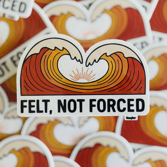 Sticker with heart-shaped waves and 'Felt, Not Forced' text on a patterned background
