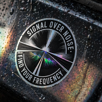Close-up of a 'Signal Over Noise' logo on a reflective surface
